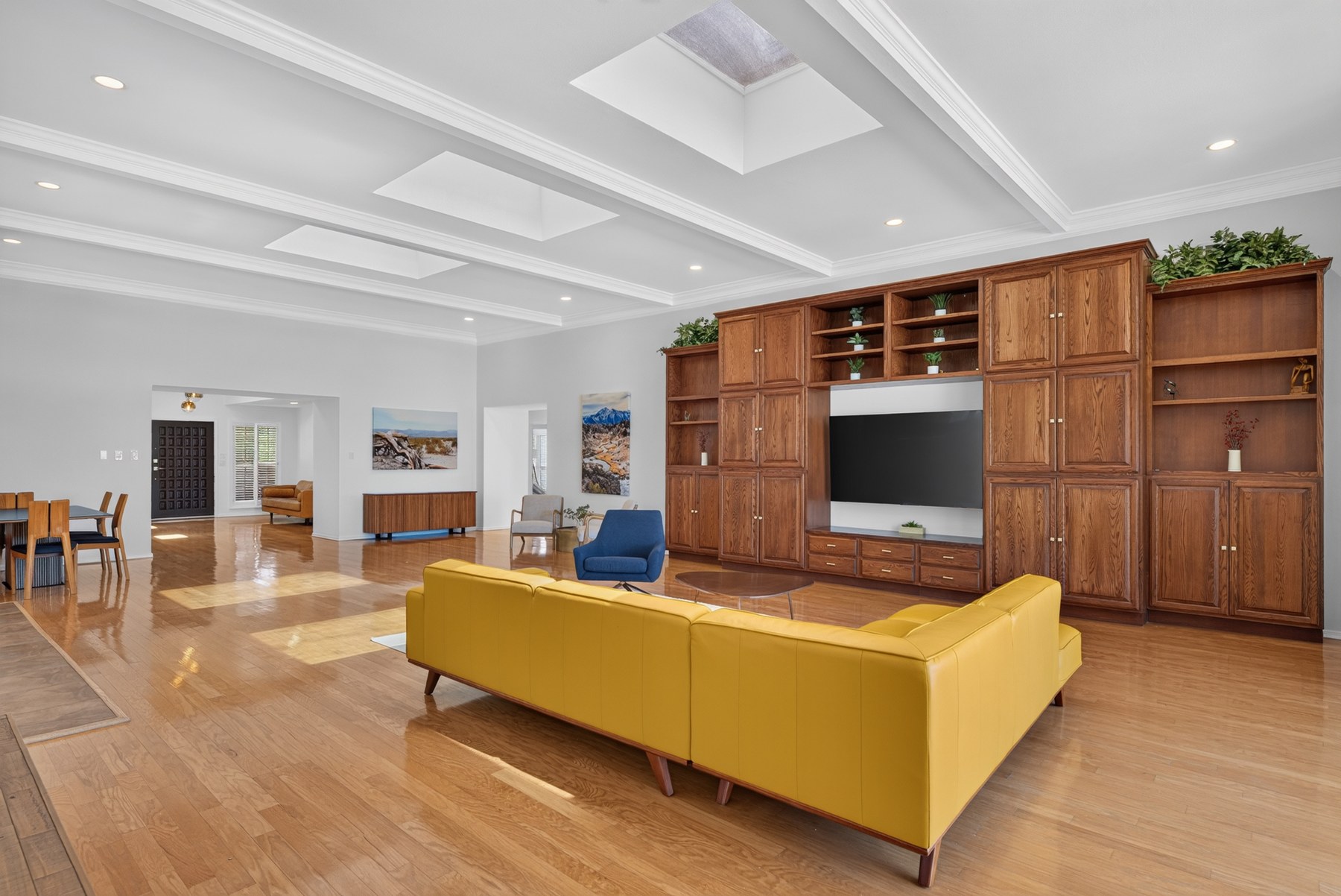 Living room with substantial wood built-ins at 1013 Singing Hills